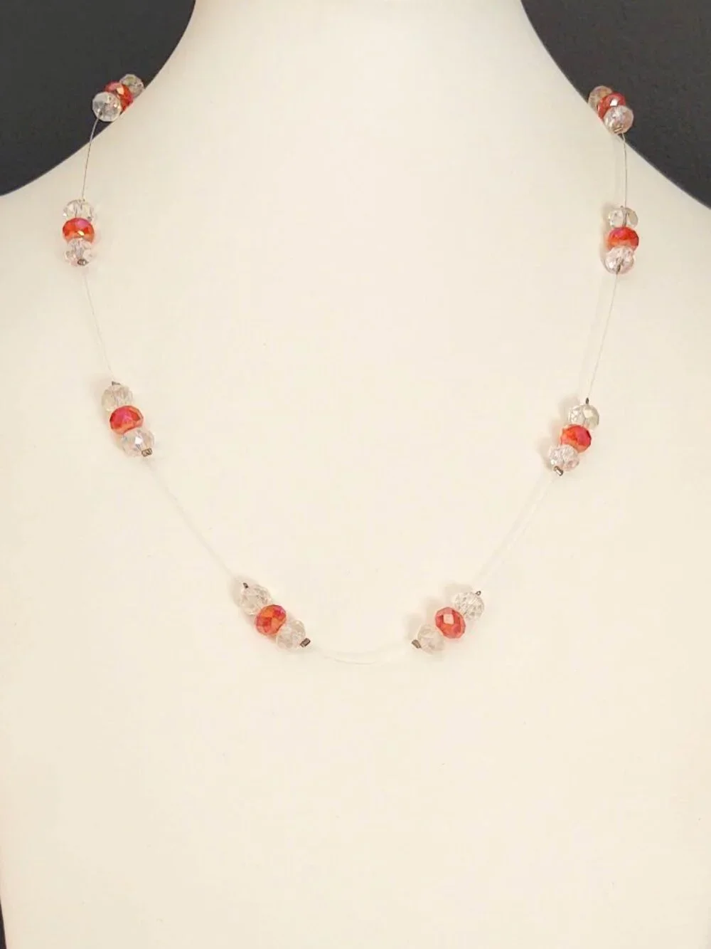 Floating clear and orange crystal necklace